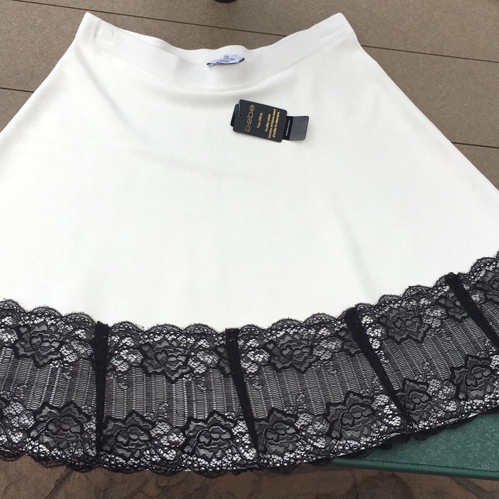 NWT bebe white sweater skirt w/ black lace detail